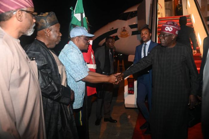President Bola Tinubu being welcomed to Abuja by some top officials on November 22, 2023